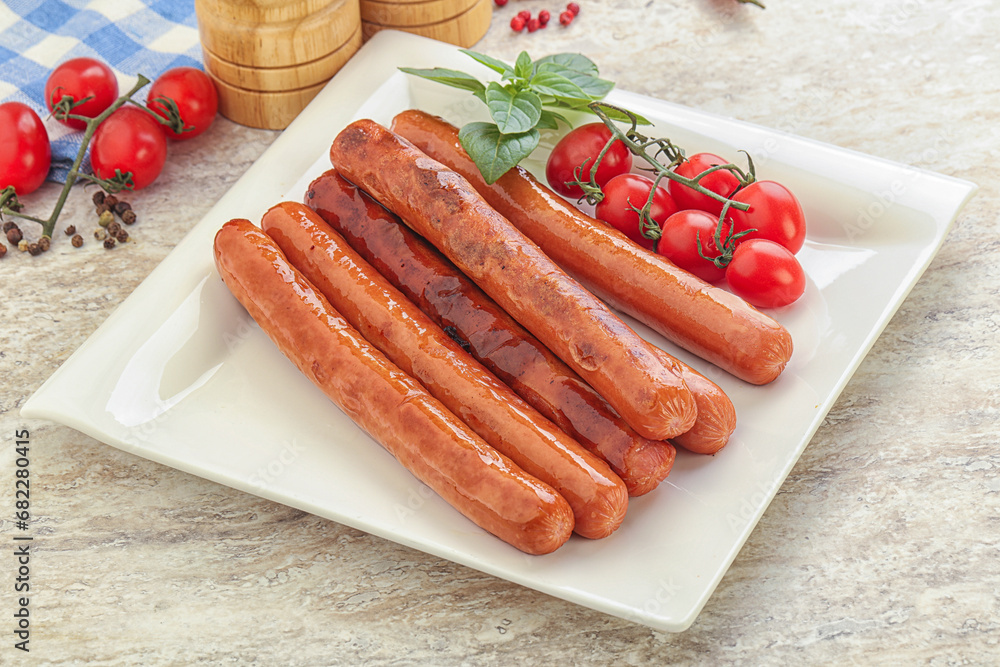 Roasted sausages in the plate Roasted sausages in the plate