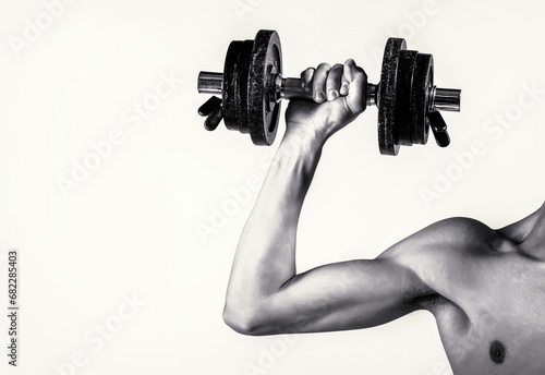 Skinny guy hold dumbbells up in hands. A thin man in sports with dumbbells. Weak hand man lift a weight, dumbbells. Nerd maleraising a dumbbell. Black and white