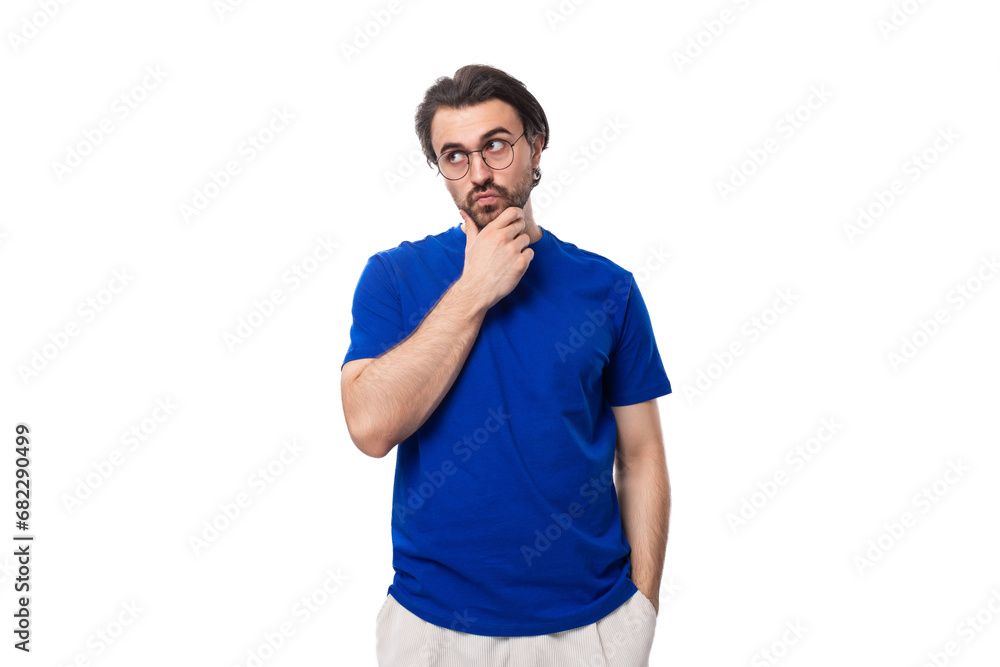 portrait of handsome young brunette european man with beard in casual blue t-shirt portrait of handsome young brunette european man with beard in casual blue t-shirt
