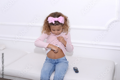 Diabetic girl injecting insulin in hers stomach 