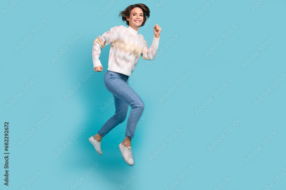 Full body size cadre of jumping effective worker woman young age running hurry fast speed overjoyed isolated on blue color background
