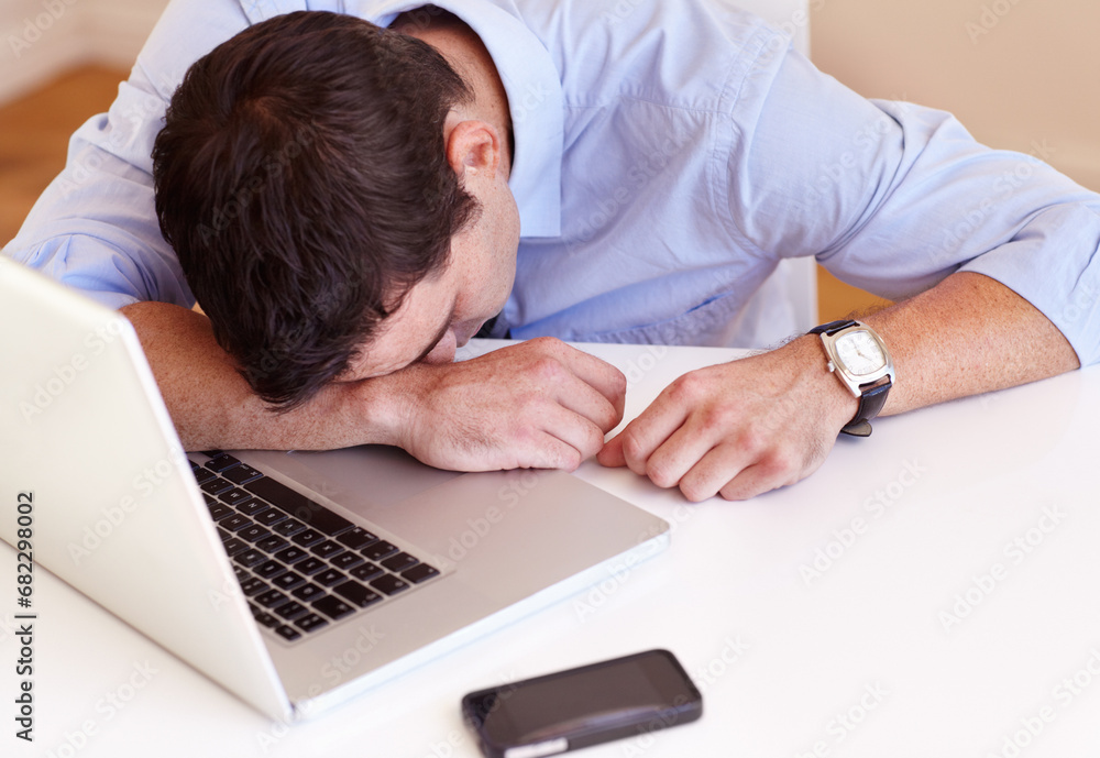 Business man, sleep and laptop at desk in office with fatigue, frustrated or tired for stress in workplace. Accountant, computer and burnout with smartphone, exhausted or overtime at financial agency Business man, sleep and laptop at desk in office with fatigue, frustrated or tired for stress in workplace. Accountant, computer and burnout with smartphone, exhausted or overtime at financial agency