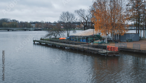 Autumn landscape with an empty river pier.