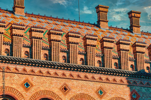 Decorative elements roof of old house, university in Chernivtsi. Red Brick House