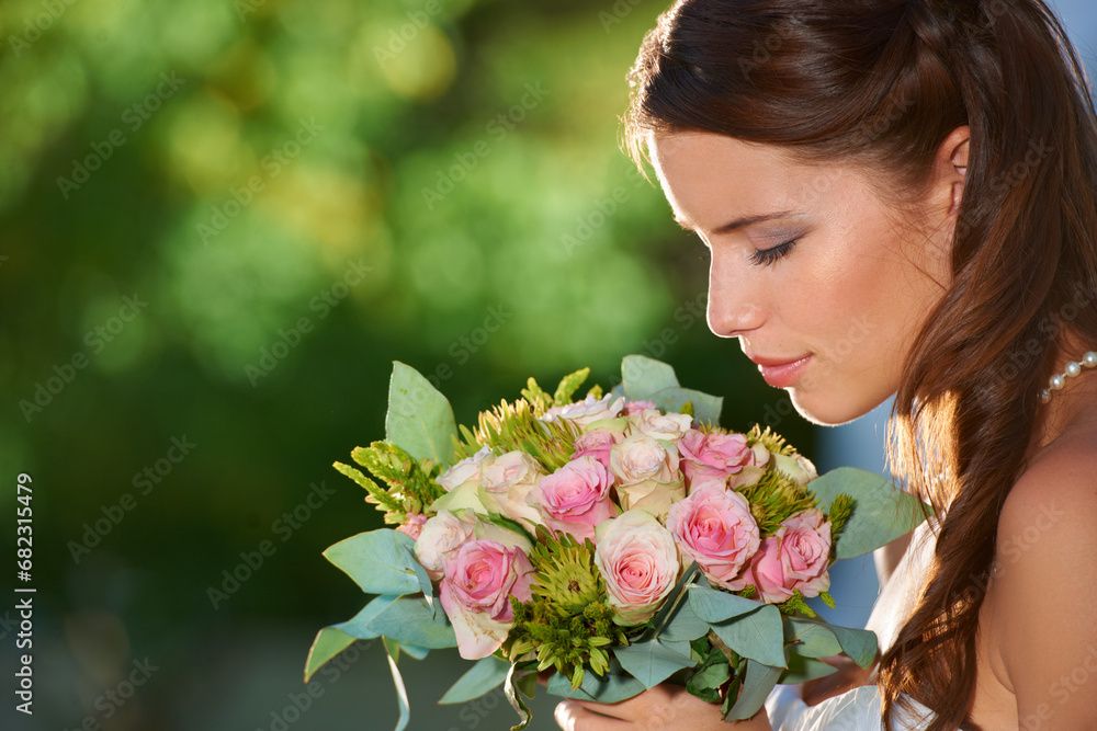 Fototapeta premium Woman, smell and wedding rose bouquet with love, commitment and trust ceremony for marriage. Engagement, celebration and flowers for event in a park with a red floral plant and bride dress outdoor