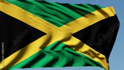 Close-up of the national flag of Jamaica flutters in the wind on a sunny day , 4k slow motion photo