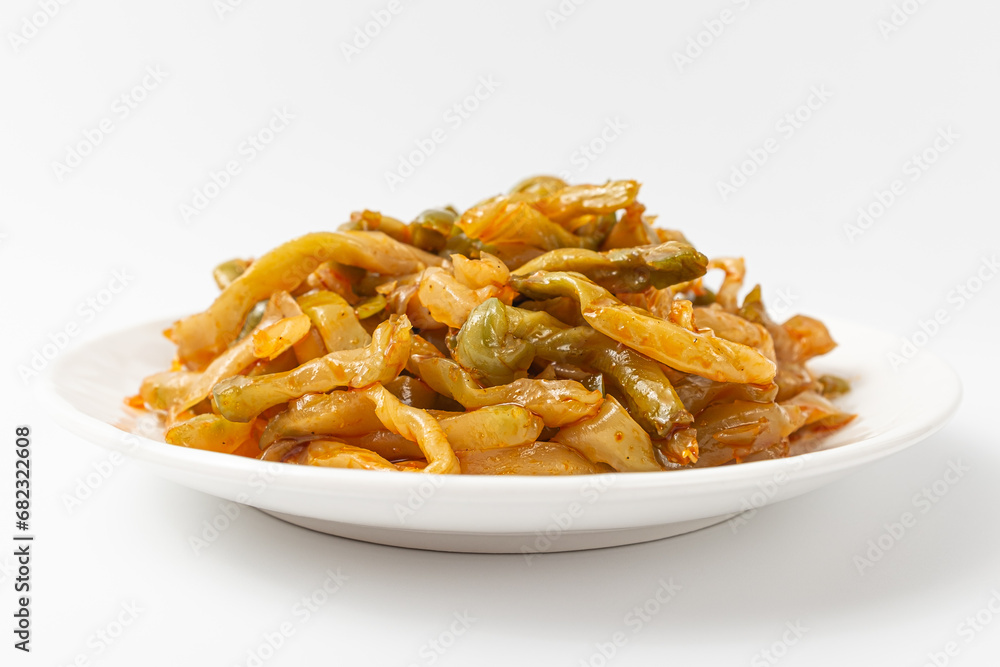 Seasoned zhacai pickles on white background Seasoned zhacai pickles on white background