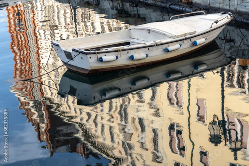 Obraz na płótnie Scenic view of Boat reflected in the Grand Canal in the center of Trieste w salonie