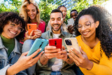 Group of young people using smart mobile phone outdoors - Happy friends with smartphone laughing together watching funny video on social media platform - Tech and modern life style concept