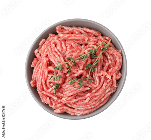Fresh raw ground meat and thyme in bowl isolated on white, top view