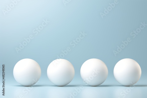  a row of white eggs sitting next to each other on a blue and white background with one egg in the middle of the row and three eggs in the same row.