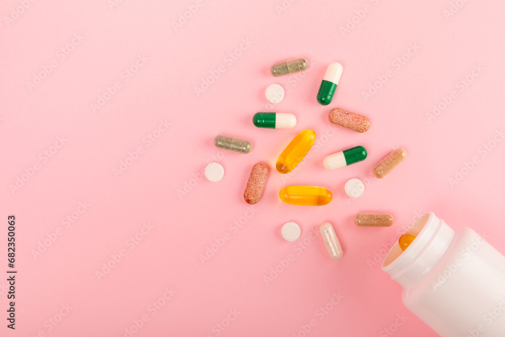 Vitamins and supplements. Variety of vitamin tablets in a jar on a texture background.Multivitamins with fresh and healthy fruits.Food supplements. Flat lay. Space for text.Copy space Vitamins and supplements. Variety of vitamin tablets in a jar on a texture background.Multivitamins with fresh and healthy fruits.Food supplements. Flat lay. Space for text.Copy space