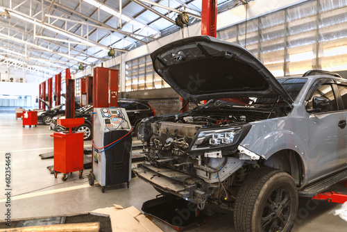 car repair in garage service station with soft-focus and over light in the background