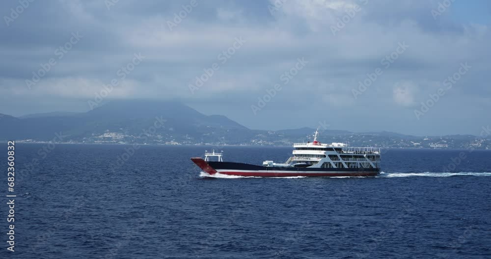 Ferry boat loaded with cars and trucks sail on sea Ferry boat loaded with cars and trucks sail on sea