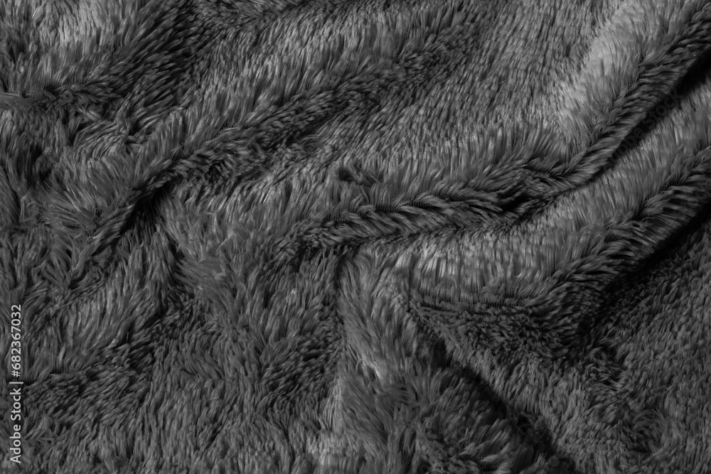 Fototapeta premium Black fur background texture. dark wool close up