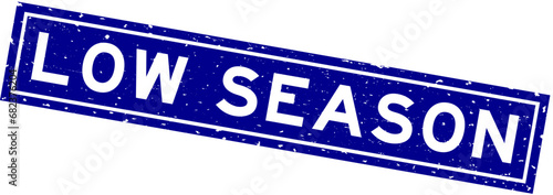 Grunge blue low season word square rubber seal stamp on white background