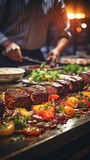 Beautiful meat plate close-up with blurry chef preparing food in sleek, contemporary kitchen with bokeh lighting in the backdrop .