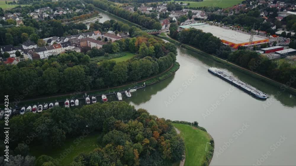 Drone aerial view of water canal with cargo ships, marina with boats at small town Datteln, Germany Drone aerial view of water canal with cargo ships, marina with boats at small town Datteln, Germany
