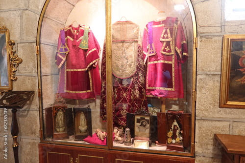 Church of the Assumption, Cadalso de los Vidrios, Madrid, Spain, November 18, 2023: Ancient clothes in the sacristy of the Parish Church of the Assumption (16th century)