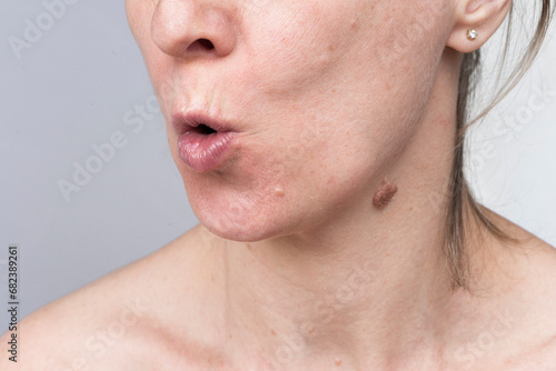 Adult woman doing face building exercises for healthy and beautiful facial skin