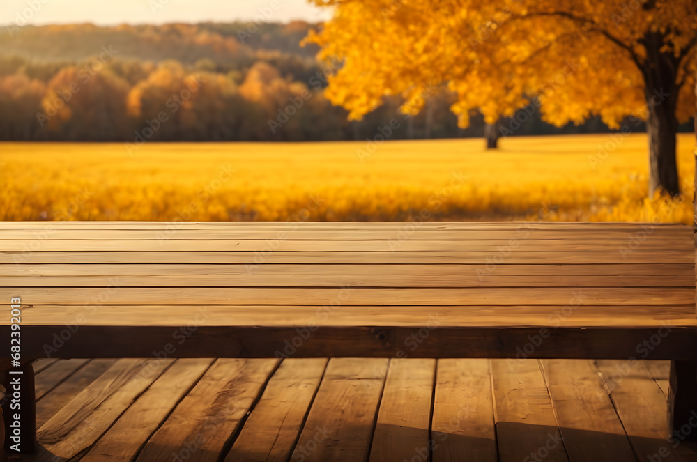 empty wooden table with beautiful autumn golden yellow meadow background