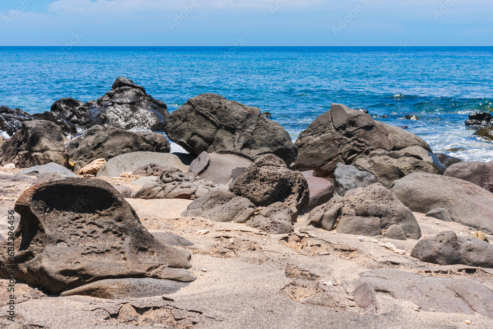 rocks on the beach with ocean