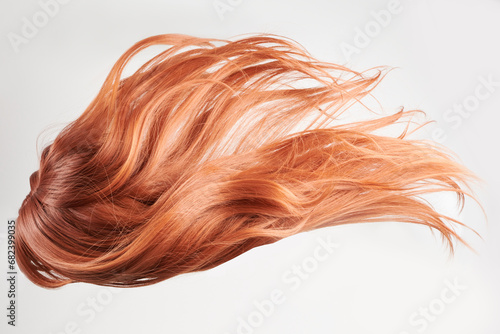 Natural looking shiny hair, red curls isolated on white background with copy space © amixstudio