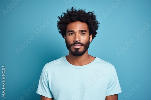 An adorable African American guy donning a T-shirt, perfect for adding text