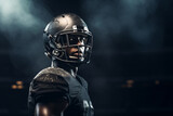 American football player of African descent in dark uniform and helmet on a dark background