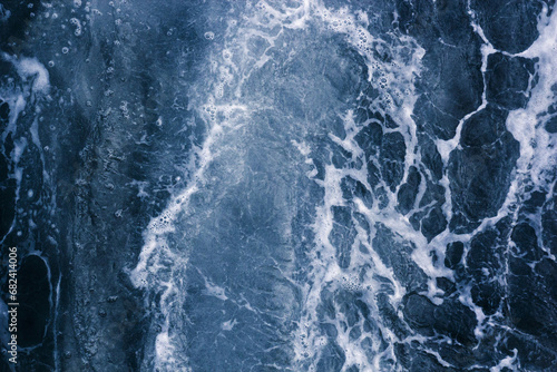Abstract blue background white veins, ocean wave, bubble and foam at high tide, pattern © Bogdan