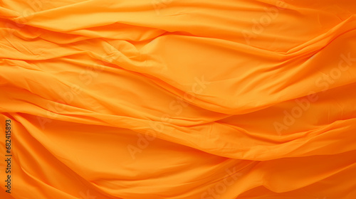 Wrinkled orange paper fragment as a background texture