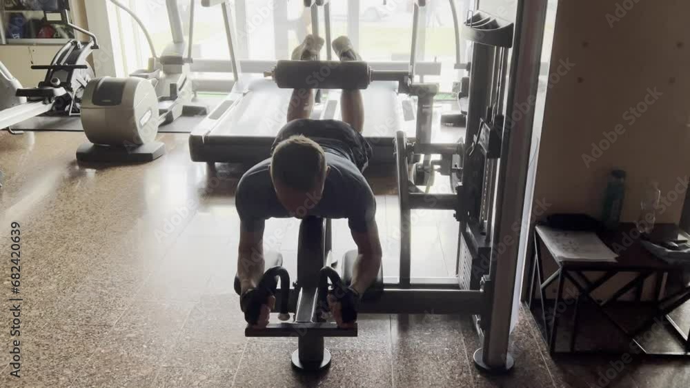 person exercising in a gym person exercising in a gym