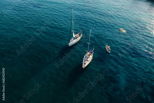 Aerial view of luxury yachts, sailing yachts, clear blue water. Travel. Cruise vacation. Yachting. © Paopano