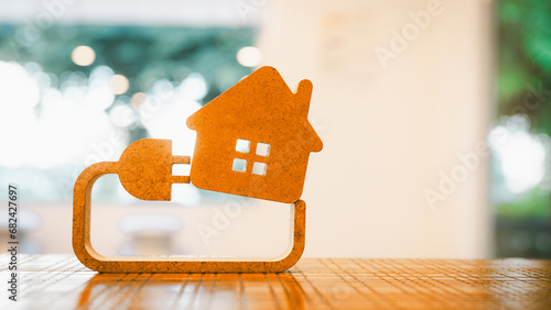 фотографія Model house and electricity and plug The concept of crazy electricity consumption and electricity bills