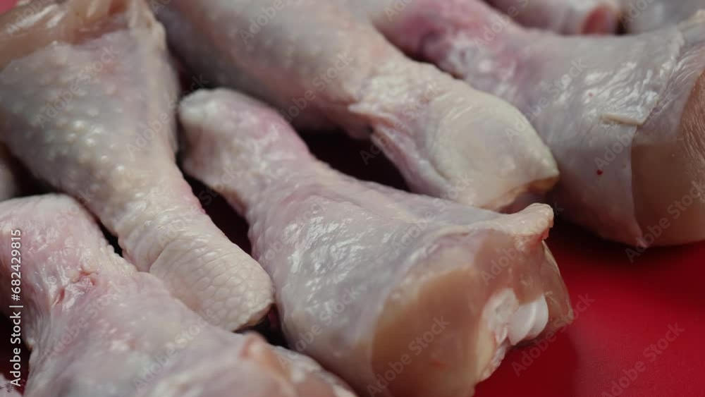 raw chicken legs rotation close-up. shop selling poultry meat. raw duck meat raw chicken legs rotation close-up. shop selling poultry meat. raw duck meat