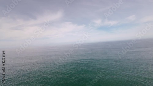 FPV drone flying over the Atlantic Ocean on the wild and beautiful Alentejo Coast in Portugal. Aerial perspective in first person view, POV photo