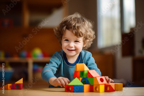 Cute toddler playing with colorful wooden blocks. Small child having fun with toys. Kid spending time in a cozy living room at home. photo