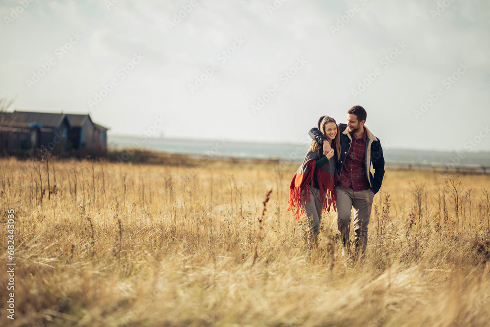 Loving young couple having romantic walk in the countryside