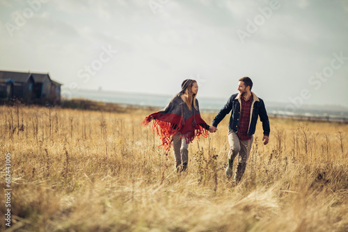 Loving young couple having romantic walk in the countryside
