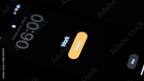 A close-up of an alarm clock ringing on a mobile phone smartphone with a reminder to go to work at 6 o'clock in the morning. High quality 4k footage