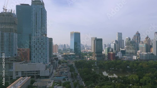 Aerial view city office building with green public park Sathorn dustrict central financial city of Bangkok Thailand photo