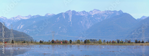 Fototapeta Naklejka Na Ścianę i Meble -  Panorama of mountain valley with power lines