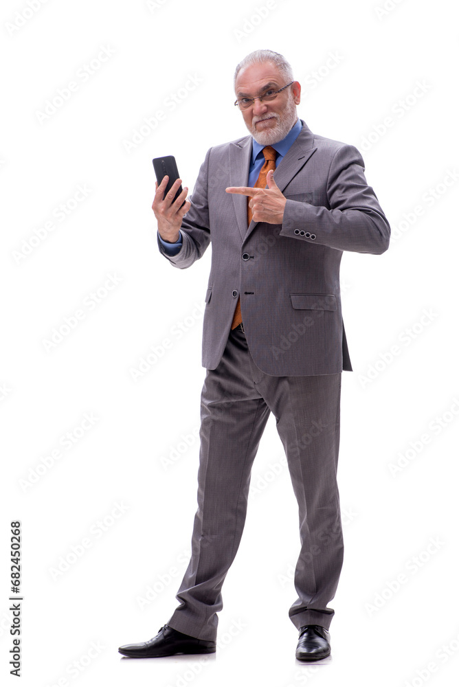 Old businessman talking by phone isolated on white Old businessman talking by phone isolated on white