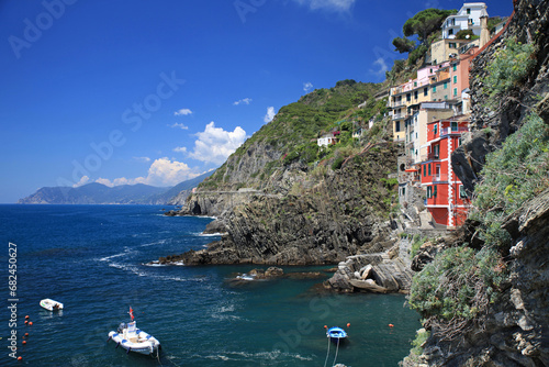 riomaggiore a village of the cinque terre on the ligurian coast with its colorful houses and boats on the mediterranean sea photo