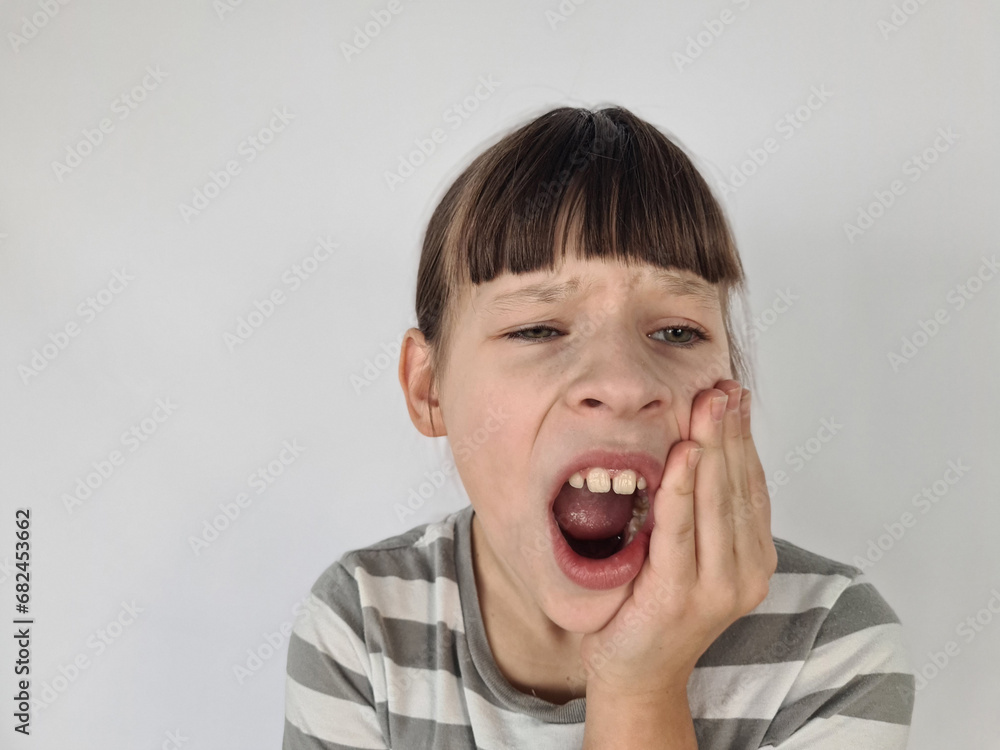 Cute little girl suffering from toothache isolated on white Cute little girl suffering from toothache isolated on white
