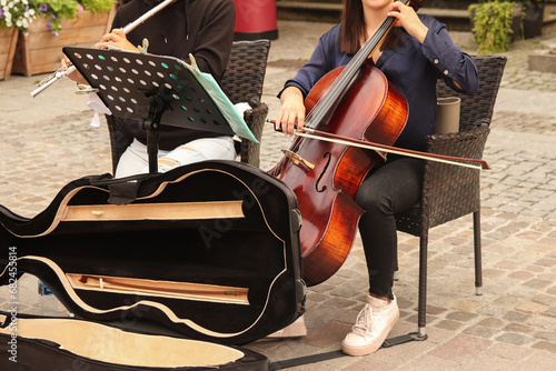 Canvas Print Street music band performing on old city background