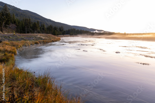 Sunrise over river in Yellowstone National Park © James