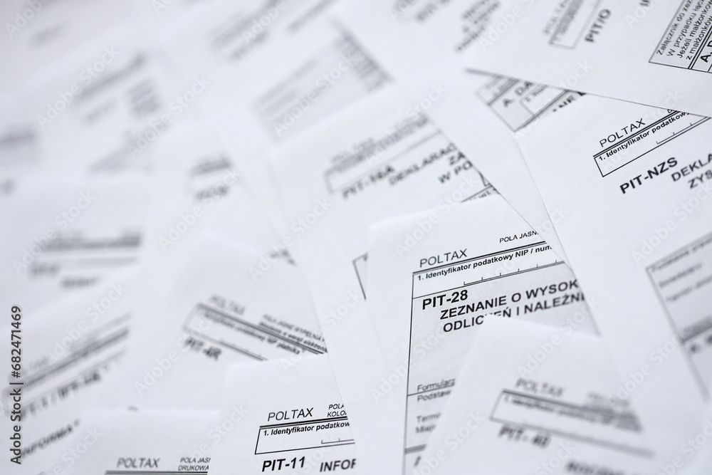 Very big amount of polish tax form blanks with PIT, CIT and VAT categories. Accounting, bureaucracy and taxpayers routine in Poland concept Very big amount of polish tax form blanks with PIT, CIT and VAT categories. Accounting, bureaucracy and taxpayers routine in Poland concept