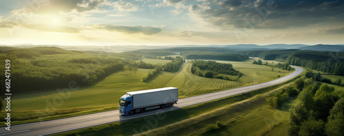 Truck on freeway top air view. Truck driving at beautiful spring landscape.