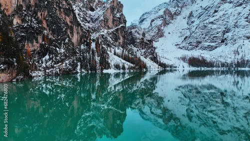 Aerial drone view of Lake Briers Pragser Wildsee Dolomites South Tyrol Italy. Autumn mountain landscape. High quality 4k footage photo